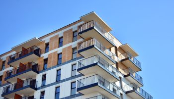 residential-building-sky-background-facade-modern-housing-construction-with-balconies